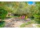 Relaxing brick patio, surrounded by colorful foliage and offering a peaceful outdoor space at 1650 Lakehurst Ave, Winter Park, FL 32789