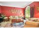 Spacious living room with red walls and large windows at 1650 Lakehurst Ave, Winter Park, FL 32789