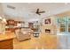 Spacious living room with hardwood floors, fireplace, and built-in shelving at 1650 Lakehurst Ave, Winter Park, FL 32789