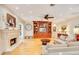 Bright living room with hardwood floors, fireplace, and a built-in entertainment center at 1650 Lakehurst Ave, Winter Park, FL 32789