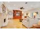 Living room features hardwood floors, fireplace, and built-in shelving at 1650 Lakehurst Ave, Winter Park, FL 32789