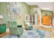 Cozy reading room with green walls, built-in shelves, and comfortable seating at 1650 Lakehurst Ave, Winter Park, FL 32789