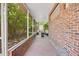 Brick screened porch with tile flooring and backyard access at 1650 Lakehurst Ave, Winter Park, FL 32789
