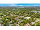 Aerial view of a neighborhood near a lake with various house styles at 1650 Lakehurst Ave, Winter Park, FL 32789