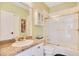 Clean bathroom with a shower/tub combo, white tile, and a granite countertop at 1650 Lakehurst Ave, Winter Park, FL 32789