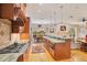 Open kitchen with island, granite countertops, and breakfast nook at 1650 Lakehurst Ave, Winter Park, FL 32789