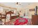 Spacious main bedroom with a large bed, red rug, and ensuite bathroom at 1650 Lakehurst Ave, Winter Park, FL 32789