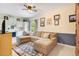 Spacious recreation room with an L-shaped couch and built in kitchenette at 1650 Lakehurst Ave, Winter Park, FL 32789