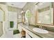 Spacious bathroom with double vanity, large mirrors and window at 1650 Lakehurst Ave, Winter Park, FL 32789