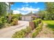 Two-car garage with brick exterior and gated driveway at 1650 Lakehurst Ave, Winter Park, FL 32789