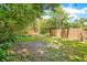 Spacious backyard with lush greenery and wooden fence at 1650 Lakehurst Ave, Winter Park, FL 32789