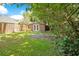 Backyard with brick shed and lush landscaping at 1650 Lakehurst Ave, Winter Park, FL 32789