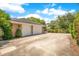Two-car garage with brick exterior and large driveway at 1650 Lakehurst Ave, Winter Park, FL 32789