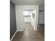 Open kitchen with white cabinets, gray tile backsplash and flooring at 2557 N Alafaya Trl # 111, Orlando, FL 32826