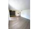 Spacious living room with gray laminate wood flooring at 2557 N Alafaya Trl # 111, Orlando, FL 32826