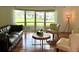 Living room with large bay windows and hardwood floors at 349 Bodie St, Longwood, FL 32750