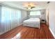 Bright bedroom with hardwood floors and large windows at 349 Bodie St, Longwood, FL 32750