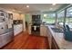 Updated kitchen with stainless steel appliances and hardwood floors at 349 Bodie St, Longwood, FL 32750