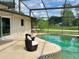 Screened pool and patio area with wicker chairs at 349 Bodie St, Longwood, FL 32750