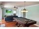 Game room with pool table and view of the backyard at 349 Bodie St, Longwood, FL 32750