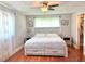 Main bedroom with a king-size bed and walk-in closet at 349 Bodie St, Longwood, FL 32750