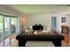 Spacious living room with hardwood floors and ample natural light at 349 Bodie St, Longwood, FL 32750