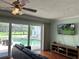 Gathering room with pool view and sliding glass doors at 349 Bodie St, Longwood, FL 32750