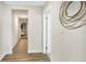 Bright hallway with wood-look flooring and access to bedrooms at 1500 N Clearview Ave, Deland, FL 32724