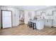 Modern kitchen with white shaker cabinets, quartz countertops, and island at 1500 N Clearview Ave, Deland, FL 32724
