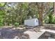 Large backyard with mature trees and a storage shed at 1500 N Clearview Ave, Deland, FL 32724