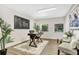 Home office with a desk, two armchairs and large world map at 1500 N Clearview Ave, Deland, FL 32724