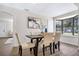Dining area with a wooden table and four beige chairs at 1500 N Clearview Ave, Deland, FL 32724