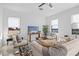 Spacious living room with comfortable seating and large windows at 6234 Chorus Dr, Mascotte, FL 34753