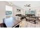 Living room with comfortable seating and wood-look flooring at 744 La Mirage St, Davenport, FL 33897
