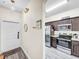 Modern kitchen with stainless steel appliances and granite countertops at 744 La Mirage St, Davenport, FL 33897