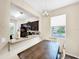 Kitchen with granite countertop and pass-through to dining area at 744 La Mirage St, Davenport, FL 33897