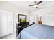 Bedroom with king-size bed, dresser, and access to bathroom at 744 La Mirage St, Davenport, FL 33897
