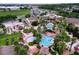 Resort-style pool area with multiple pools and palm trees at 744 La Mirage St, Davenport, FL 33897