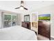 King bed, dresser, ensuite bathroom, TV at 744 La Mirage St, Davenport, FL 33897