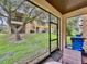 View from screened patio showing backyard and neighboring homes at 744 La Mirage St, Davenport, FL 33897