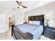 Bedroom with queen-size bed, nightstands, and access to bathroom at 744 La Mirage St, Davenport, FL 33897