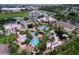 Large resort pool with multiple pools and surrounding amenities at 744 La Mirage St, Davenport, FL 33897