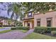 Two-story house with brown roof and landscaping at 744 La Mirage St, Davenport, FL 33897