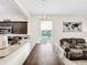 Bright dining area with kitchen pass-through and seating for four at 744 La Mirage St, Davenport, FL 33897