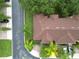 Aerial view of a house showing brown roof and landscaping at 744 La Mirage St, Davenport, FL 33897