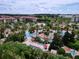 Aerial view showing resort pools, palm trees, and surrounding buildings at 744 La Mirage St, Davenport, FL 33897