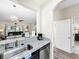 Kitchen with granite countertops, stainless steel appliances, and breakfast bar at 744 La Mirage St, Davenport, FL 33897