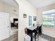 Small kitchenette with granite countertop and window views at 744 La Mirage St, Davenport, FL 33897