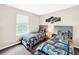 Bedroom with two twin beds and Star Wars bedding at 744 La Mirage St, Davenport, FL 33897