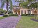 Two-story townhome with landscaping and a brick paver walkway at 744 La Mirage St, Davenport, FL 33897